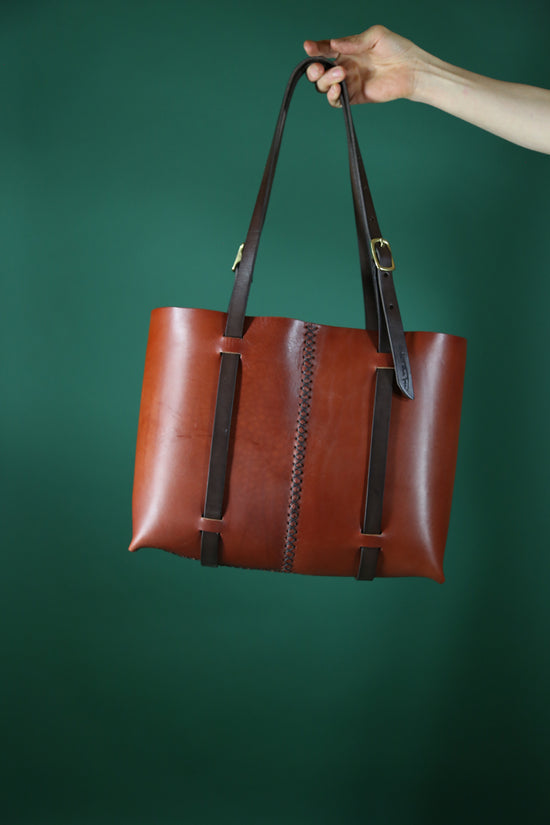 The Weekday tote in Cherrywood Red steerhide